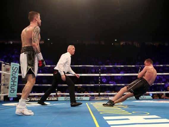 Scotty Cardle hits the deck after the blow by Ricky Burns which ended their Manchester fight