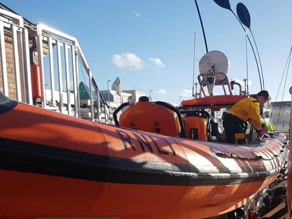 A lifeboat was scrambled to rescue two people in the sea off Rossall Point in Fleetwood.