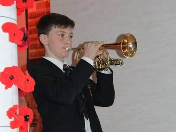 14 year-old Ben Parkinson plays the Last Post.