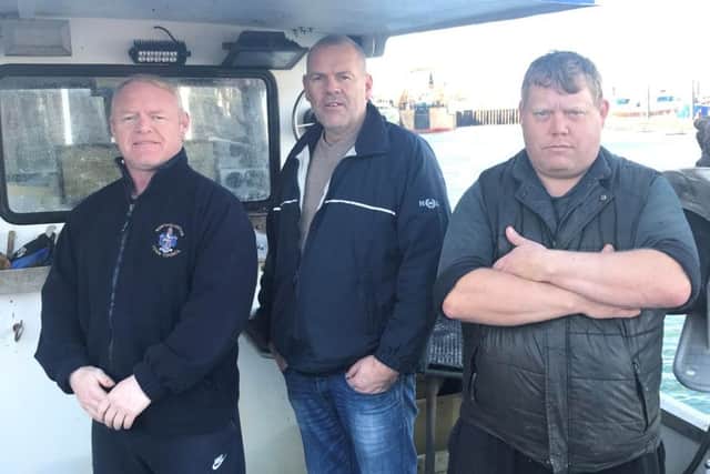 Three rescuers (from left) - Kenneth Hargreaves, Frans Schaap and Darren Moore on board catamaran Pisces.