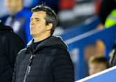 Fleetwood Town manager Joey Barton watches on