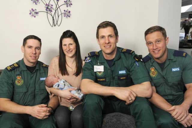 Five years ago ... Sarah Porter and baby Rory Campbell with the paramedic team that saved his life