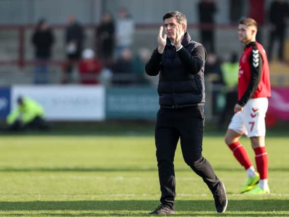 Joey Barton applauds the Fleetwood fans after the Saddlers stalemate