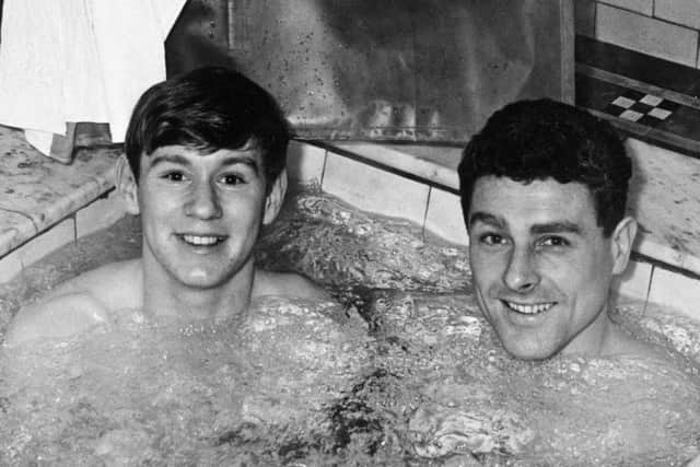 Manchester City players David Wagstaffe (left) and Barrie Betts pictured in 1962 taking tonic treatment under the supervision of Mr J H Fearn at Buxton's Thermal Baths