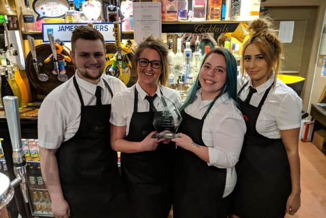 Staff at Bloomfield Brewhouse celebrate the award