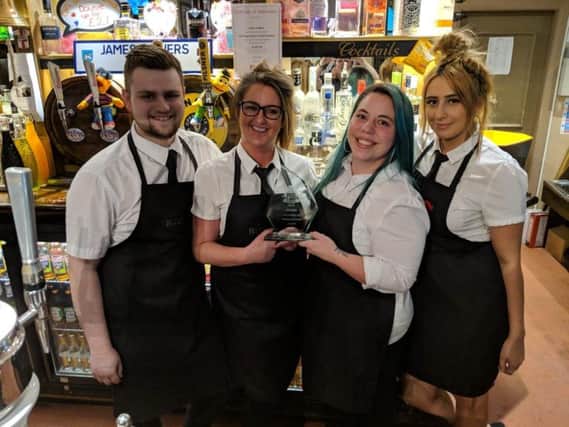 Staff at Bloomfield Brewhouse celebrate the award