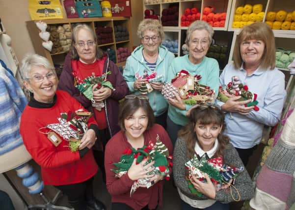 Elizabeth Dee (front left) with Linda Deacon and the knitters at Bonney Fabrics