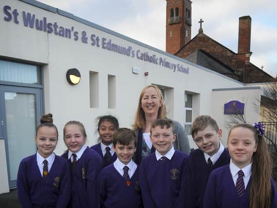St Wulstan's and St Edmund's Catholic Primary School's headteacher Jane Barnes with the house captains.
