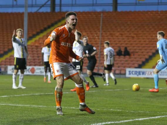 Jordan Thompson celebrates scoring Blackpool's second goal against Burton Albion