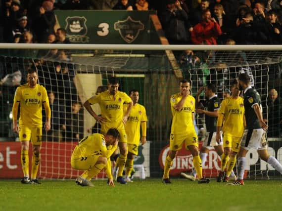 Conor McAleny sinks to his knees as Plymouth score their second