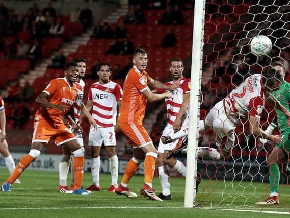 Michael Nottingham scores for Blackpool in their Carabao Cup win at Doncaster in August