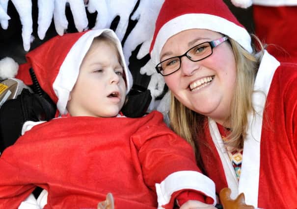 Picture by Julian Brown 03/12/17

Becky Ryan with daughter Emily (5) who is at Brian House Hospice

Santa Dash from the Sandcastle to Central Pier, Blackpool, and back in aid of Brian House Children's Hospice