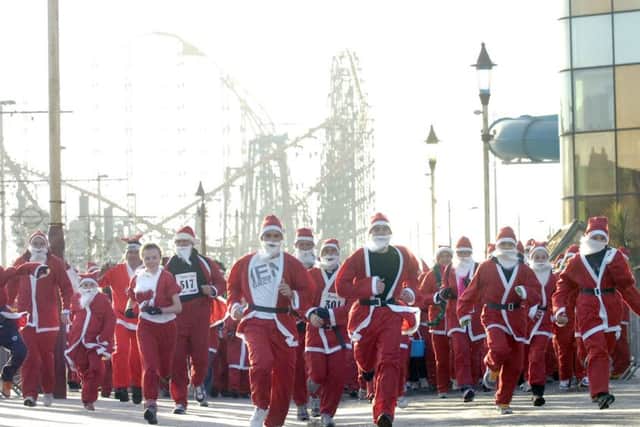 Pictures Martin Bostock
The first annual Santa dash along Blackpool Promenade in aid of Trinity Hospice.
They're off !