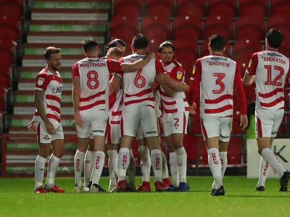 Doncaster earned their first ever win against Blackpool at the Keepmoat Stadium last night