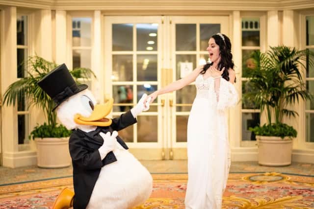 Amy wasn't having a Disney wedding without Donald Duck being there.