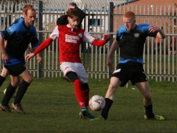 Squires Gate Reds and AFC Blackpools U15s battle for the ball Picture: KAREN TEBBUTT