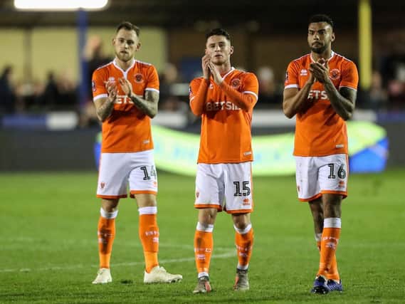 Harry Pritchard, Jordan Thompson and Curtis Tilt applaud the Blackpool fans at full time
