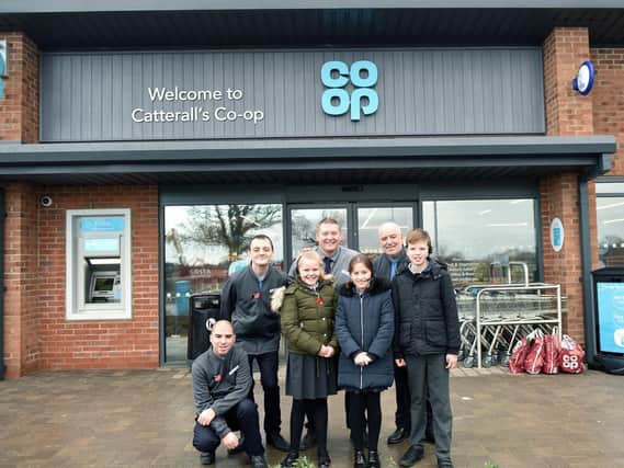 Joe Stevens, Co-op store manager pictured inset with staff