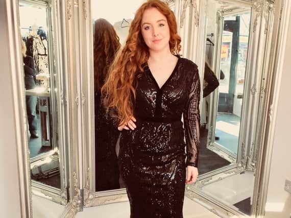 Clare Eastwood of Mirror Mirror modelling one of the gowns at the shop