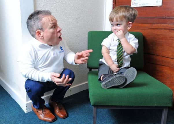 Actor Warwick Davis pays a visit to Strike Lane Primary School in Freckleton.  He is pictured with pupil Lorcan Woodman.