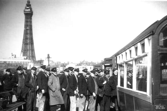 Rail workers boarding a train at Blackpool Central Station.