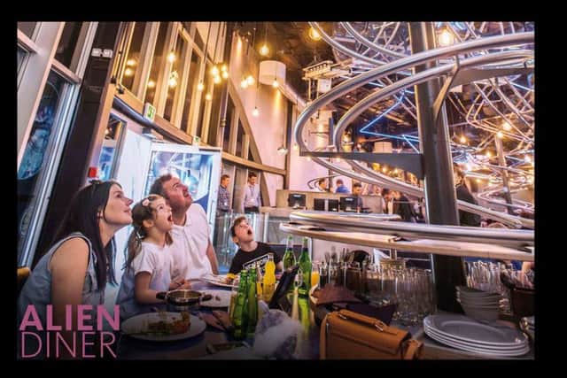 Themed bar and event restaurant concept with roller coaster service, hourly special effects shows and exploration tours