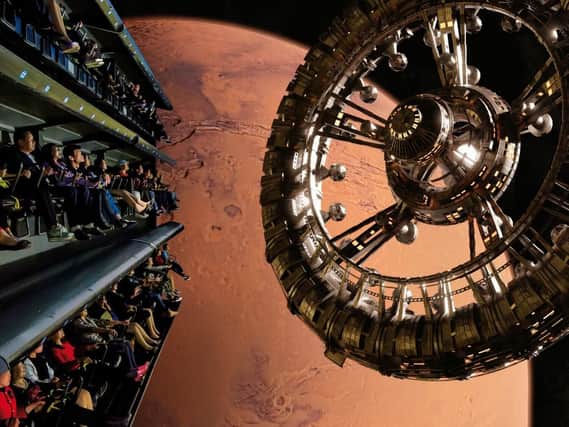 How the Flying Theatre experience could look with people in the moving seats and the huge projection