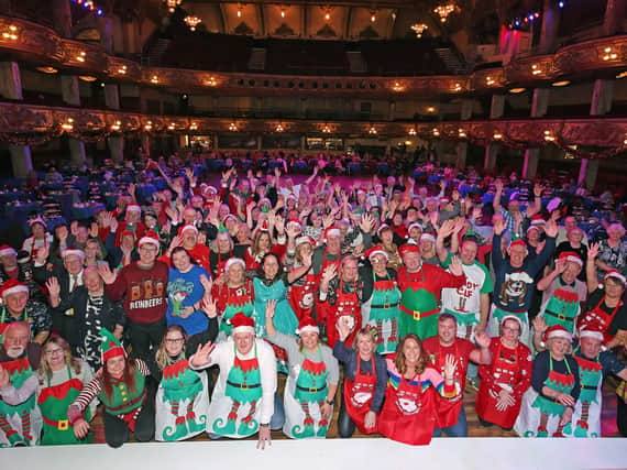 The lottery winners dressed as Christmas elves for the occasion.