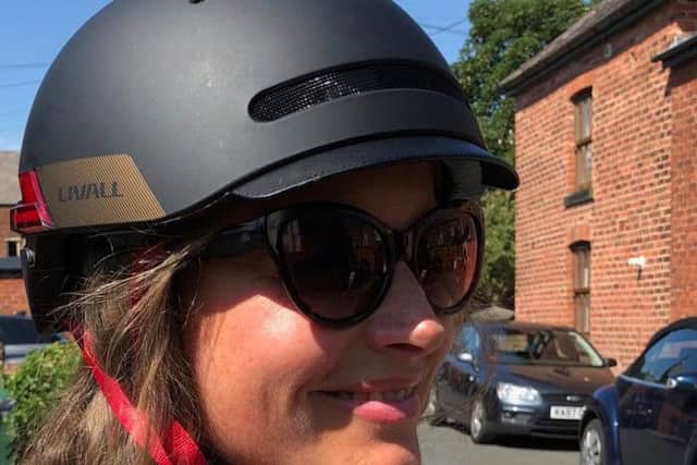 Charlotte demonstrates the Livall smart helmet