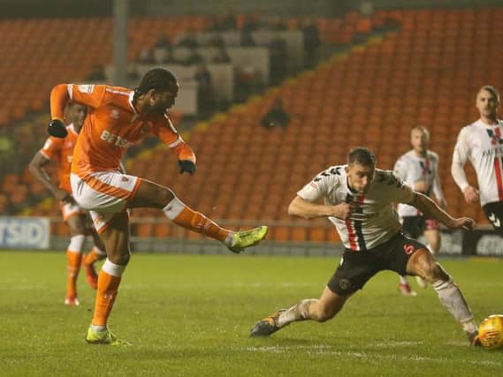 Nathan Delfouneso cooly slots home Blackpool's late winner