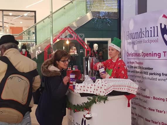 Shoppers enjoy non-alcoholic mulled wine at Houndshill