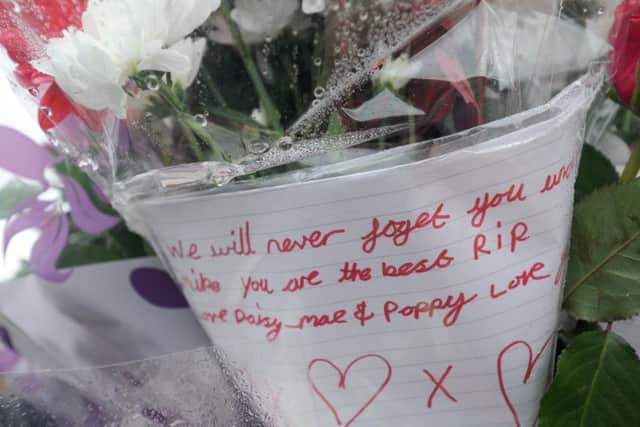 Tributes and flowers left on Broomfield Road for Michael Hart who was murdered on Sunday