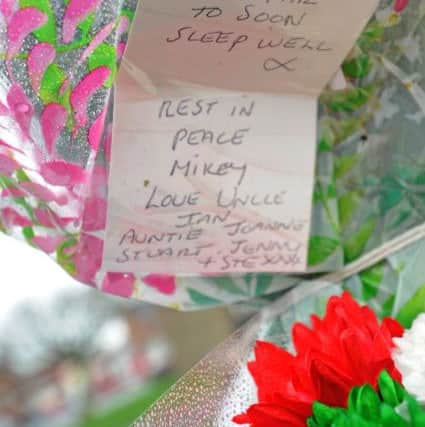 Tributes and flowers left on Broomfield Road for Michael Hart who was murdered on Sunday