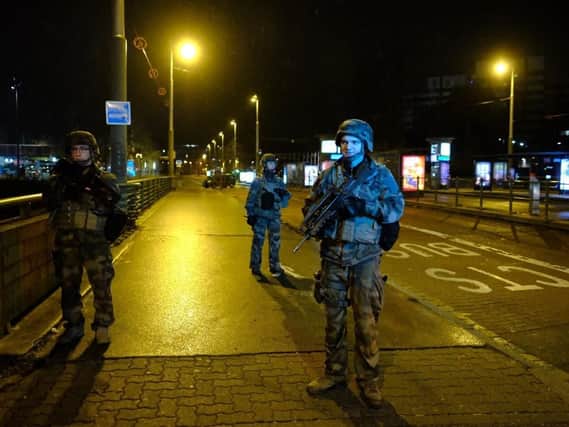 Soldiers patrol in Strasbourg, eastern France, after a shooting. French prosecutors say a terror investigation has been opened into the shooting at a Christmas market in Strasbourg that has left two dead and up to eight wounded, including several in critical condition