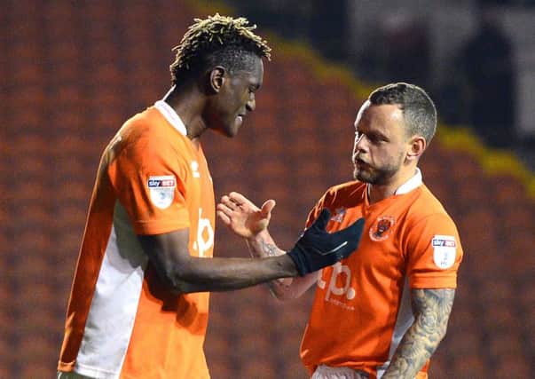 Blackpool's Armand Gnanduillet and Jay Spearing