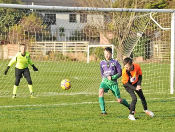 Goalmouth action between St Annes Yellows Under-14 and Poulton Town