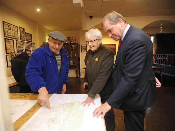 Rob Green, right, talks over aspects of the plan with Ted and Margaret Love. Inset, delivery manager Steve Smith, left, speaks to residents