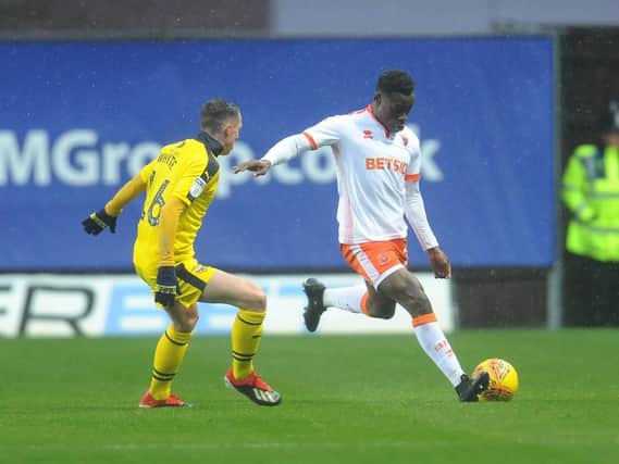 Marc Bola in action against Oxford United at the Kassam Stadium