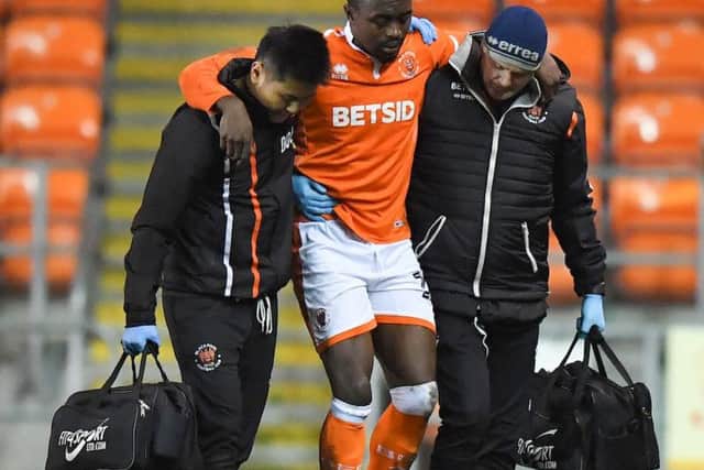 Joe Dodoo helped off the pitch after picking up an injury in last night's win