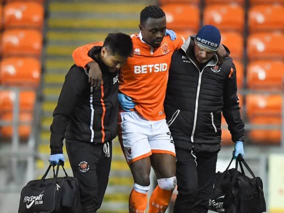 Joe Dodoo helped off the pitch after picking up an injury in last night's win