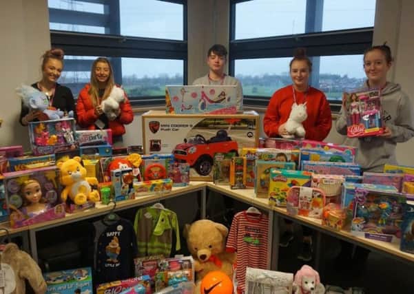 Blackpool Sixth students with presents for Cash For Kids