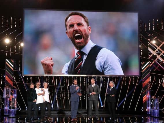 Gareth Southgate collects his coach of the year award at the BBC's Sports Personality of the Year event