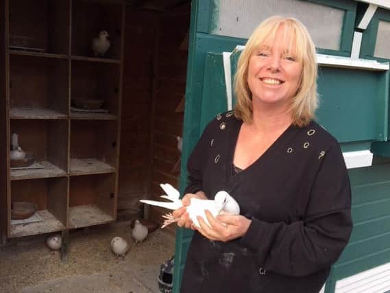 Sue Brown with one of her belove doves