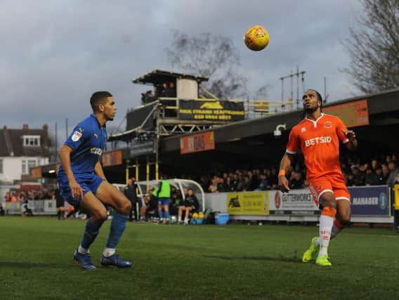 Blackpool's Nathan Delfouneso under pressure from AFC Wimbledon's Terell Thomas