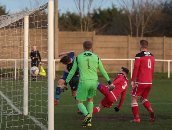 Ric Seear heads Gate's second against Whitchurch Alport  Picture: IAN DAVIES