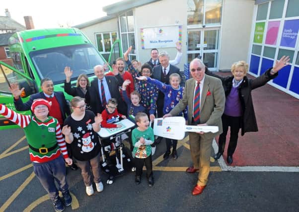 Members of the Lord's Taverners and David Moyes present the keys for a new 16-seater minibus to Pear Tree School in Kirkham