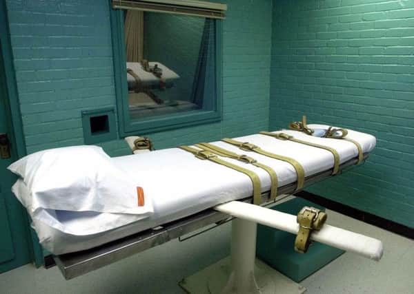FILE--The Texas death chamber is shown in this May 19, 2000 file photo, in Huntsville, Texas. Convicted killer David Dowthitt was one of several convicts executed by lethal injection in this chamber.  (AP Photo/Pat Sullivan, File)