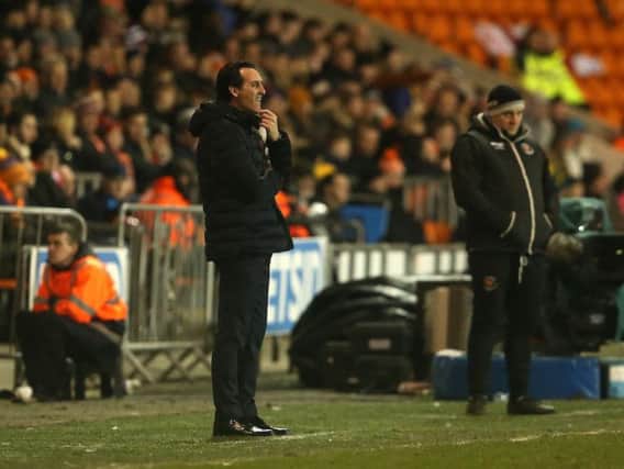 Arsenal boss Unai Emery with Blackpool assistant Gary Brabin watching on in the background