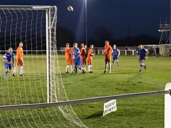 A free-kick threatens the goal at Daisy Hill