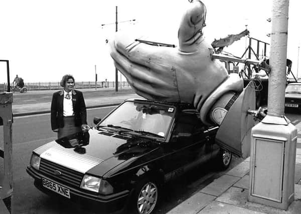 Giant illuminations hand fell on car belonging to Gail Turner , at North Shore, 1990